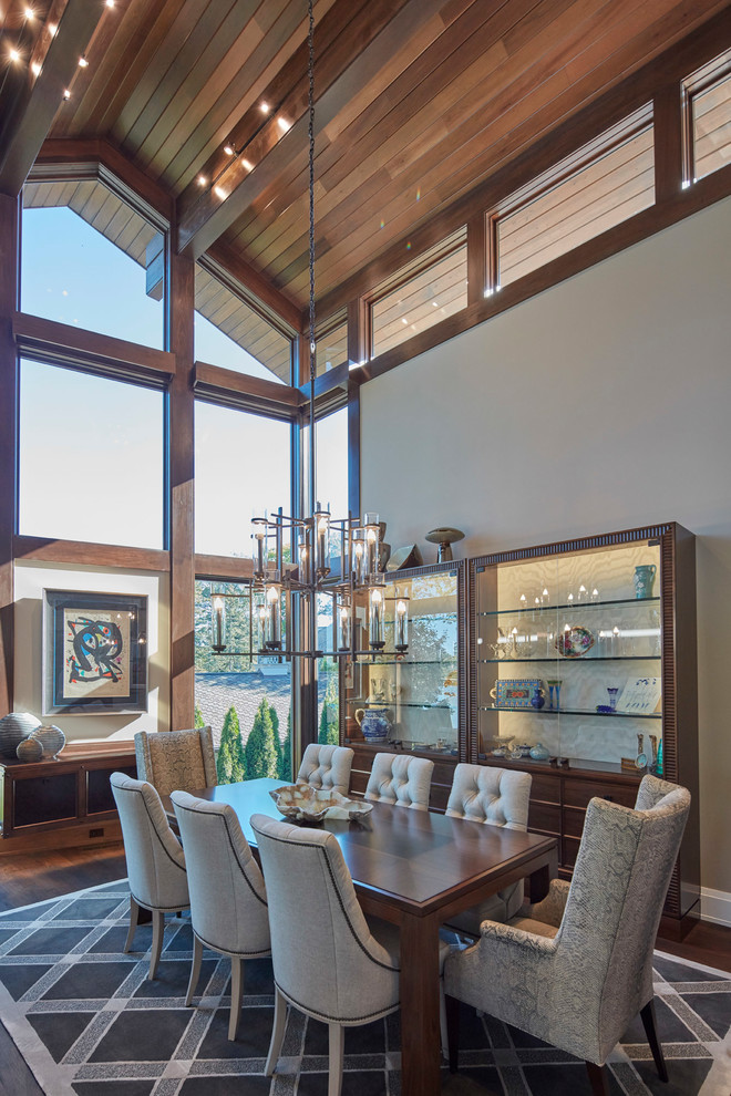 Example of a transitional painted wood floor and brown floor dining room design with gray walls
