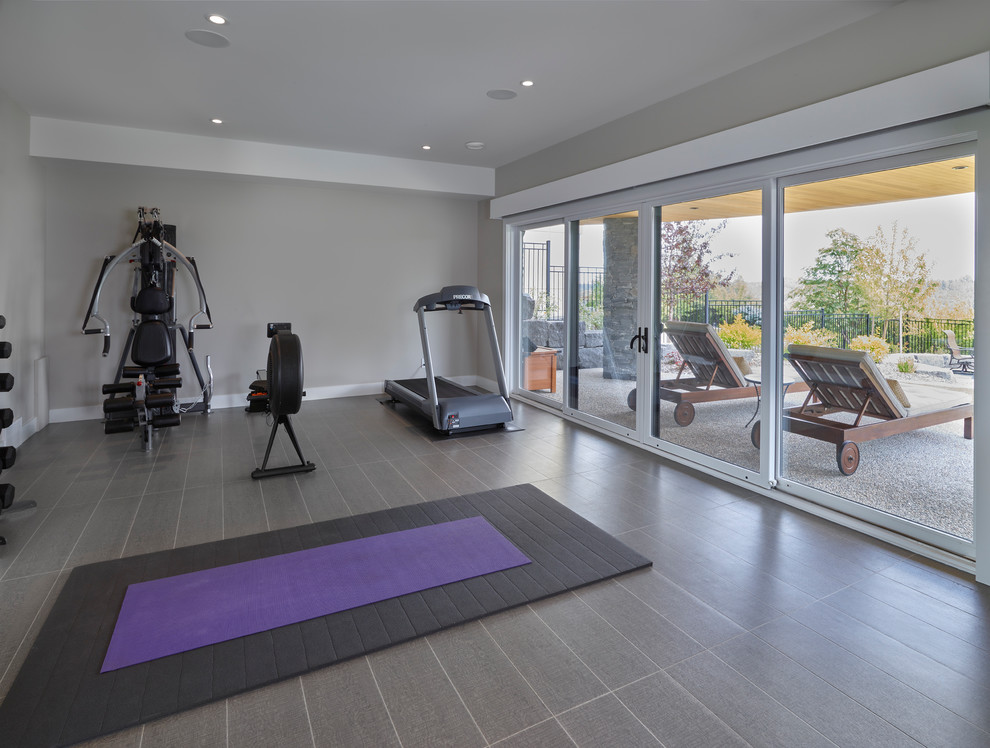 Design ideas for a transitional home gym in Edmonton.