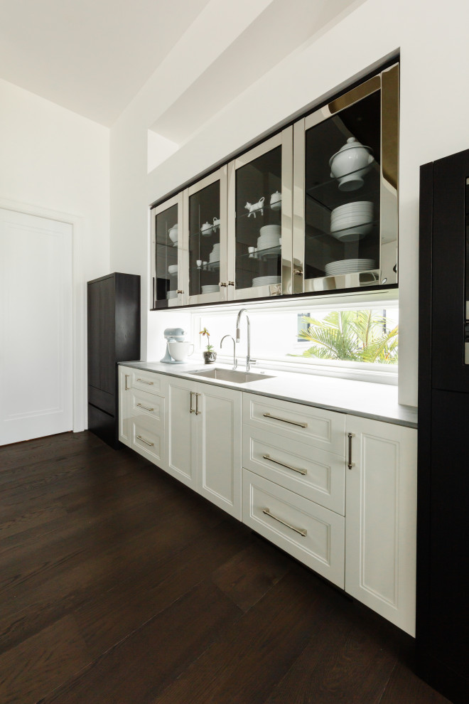 Inspiration for a transitional kitchen remodel in Tampa with an island