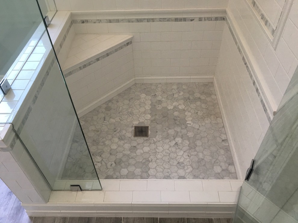 Mid-sized country master bathroom in Los Angeles with shaker cabinets, white cabinets, a corner shower, gray tile, porcelain tile, blue walls, porcelain floors, an undermount sink and marble benchtops.