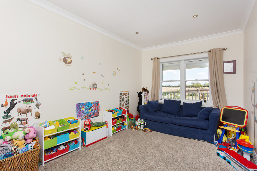 Photo of a Mid-sized country Gender-neutral kids' playroom for Kids 4-10 Years Old in Christchurch With White Walls, Carpet and Grey Floor.