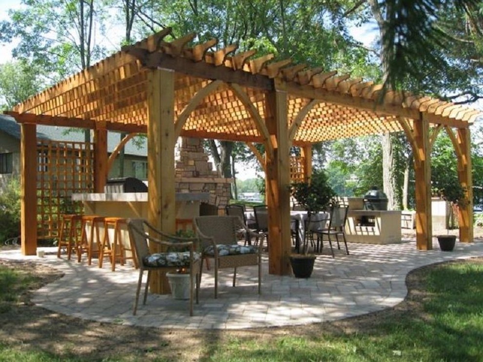 Patio - mid-sized transitional backyard patio idea with a fire pit and a pergola