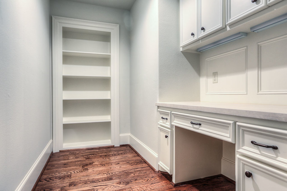 Inspiration for a mid-sized traditional gender-neutral kids' study room in Houston with grey walls and medium hardwood floors.