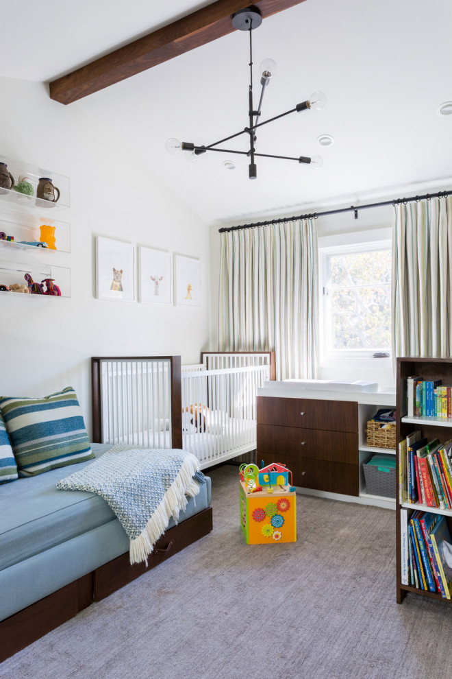 This is an example of a large contemporary gender-neutral nursery in Los Angeles with white walls, carpet and grey floor.