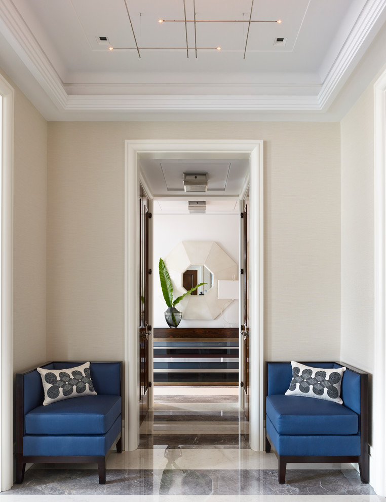 Transitional hallway in New York with beige walls.