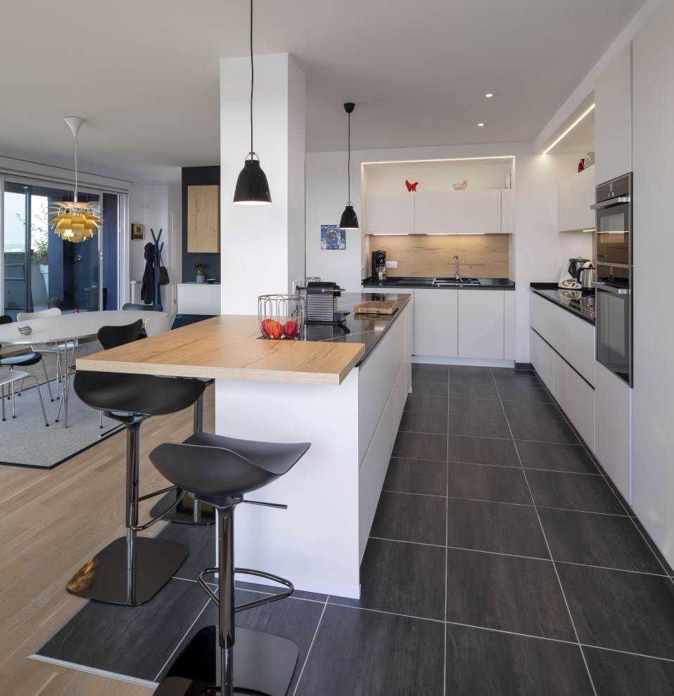 Design ideas for a mid-sized contemporary l-shaped kitchen in Strasbourg with with island.