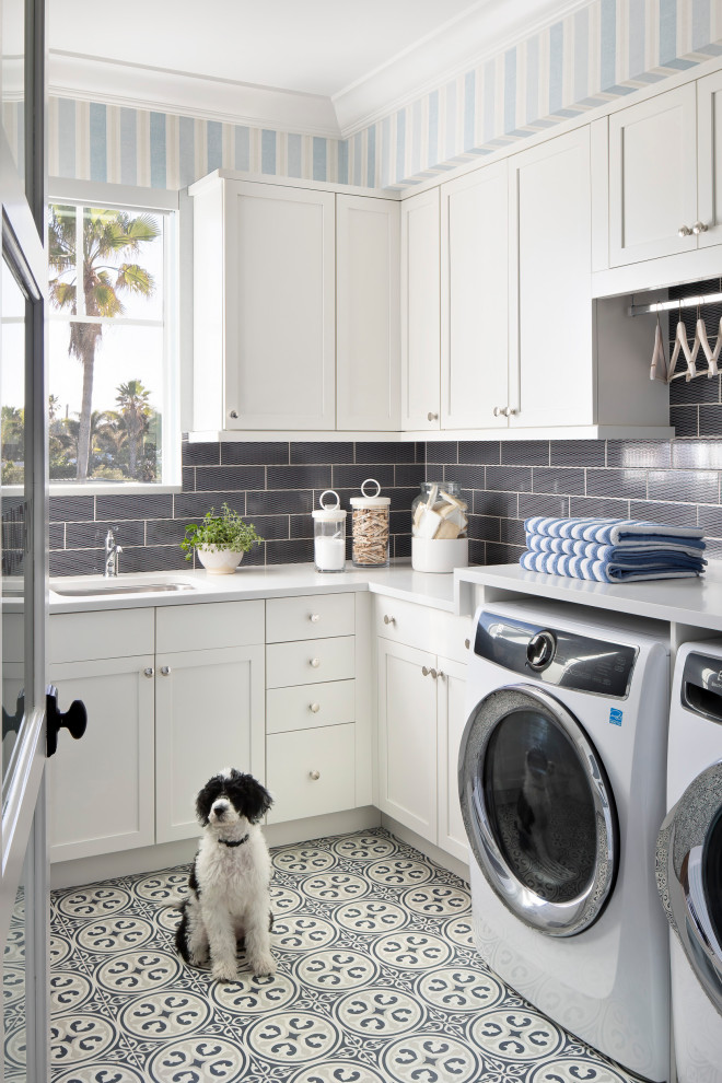 Photo of a beach style laundry room in Miami.