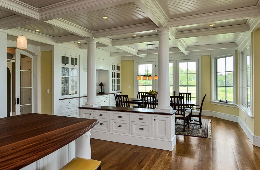 Inspiration for a mid-sized beach style kitchen/dining combo in Boston with yellow walls, medium hardwood floors and no fireplace.