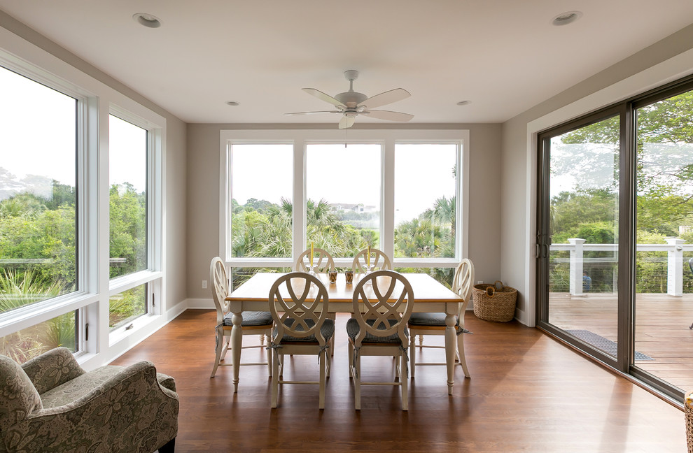 Beach style open plan dining in Charleston with grey walls and medium hardwood floors.