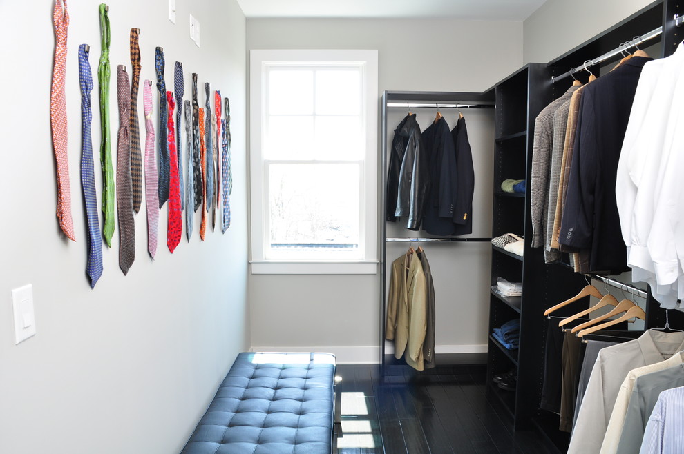 Photo of a contemporary men's storage and wardrobe in Atlanta with open cabinets and black cabinets.