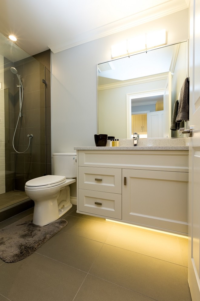 Design ideas for a mid-sized contemporary bathroom in Other with flat-panel cabinets, white cabinets, grey walls, porcelain floors, an undermount sink, engineered quartz benchtops and white benchtops.