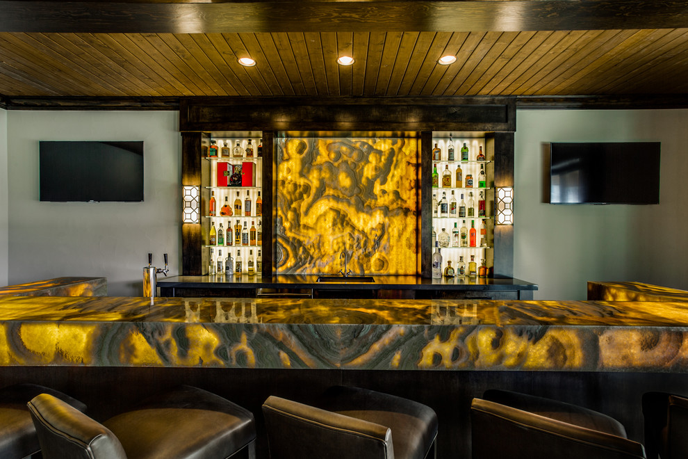 Expansive contemporary u-shaped seated home bar in Dallas with an undermount sink, open cabinets, dark wood cabinets, onyx benchtops, yellow splashback, stone slab splashback and dark hardwood floors.