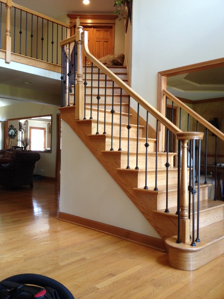 Photo of a contemporary wood l-shaped staircase in Chicago with wood risers.