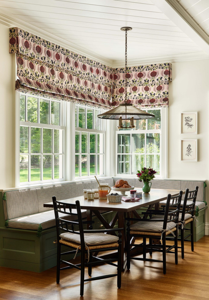 Elegant medium tone wood floor, brown floor, exposed beam and shiplap ceiling breakfast nook photo in New York with white walls
