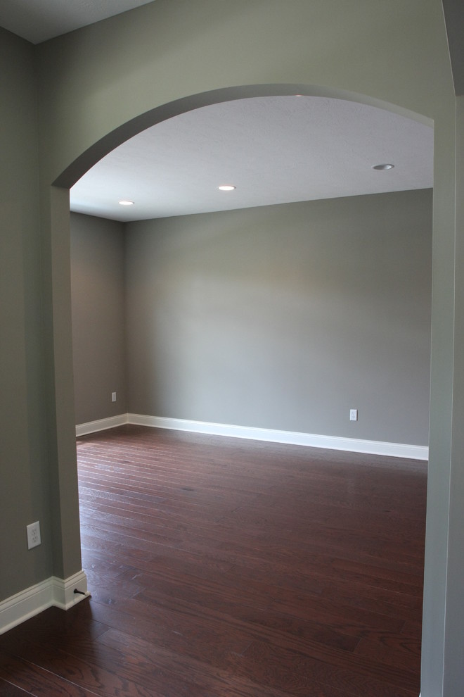 Photo of a large arts and crafts separate dining room in Indianapolis with grey walls and dark hardwood floors.