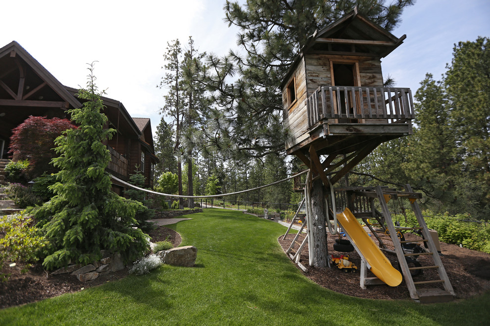 This is an example of a traditional garden in Seattle with with outdoor playset.