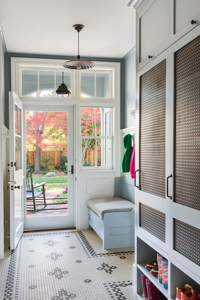 This is an example of a large traditional mudroom in San Francisco with grey walls, a dutch front door, a white front door, ceramic floors and multi-coloured floor.