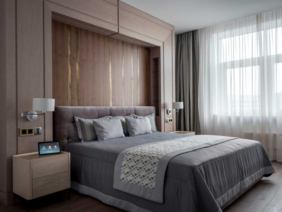 Inspiration for a large contemporary master bedroom in Moscow with beige walls, medium hardwood floors and brown floor.