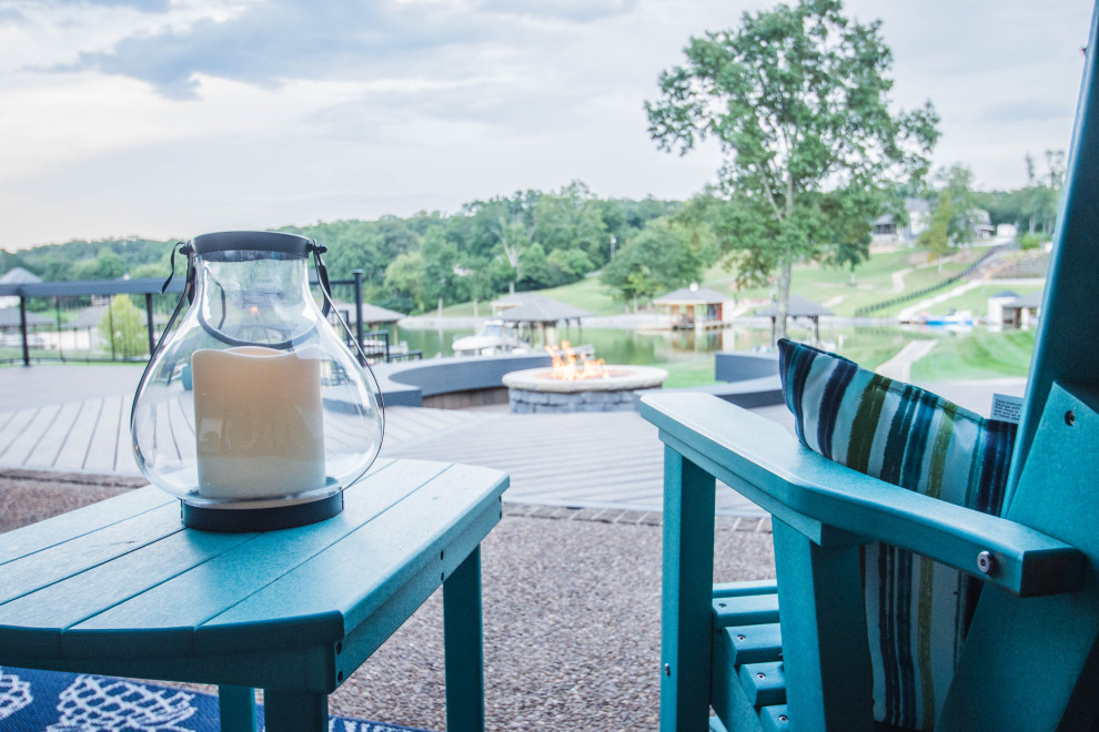 Inspiration for a large transitional backyard deck remodel with a fire pit and no cover
