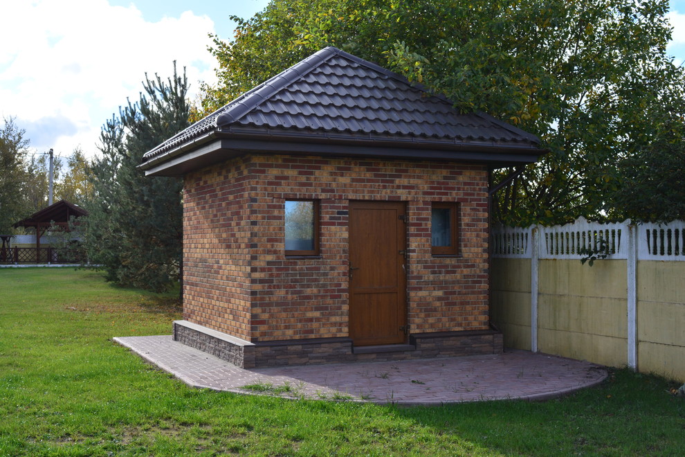 This is an example of a contemporary detached shed and granny flat in Saint Petersburg.