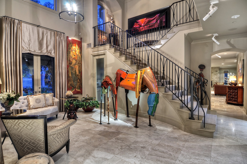 Inspiration for a large contemporary marble floor foyer remodel in Orange County with gray walls and a glass front door