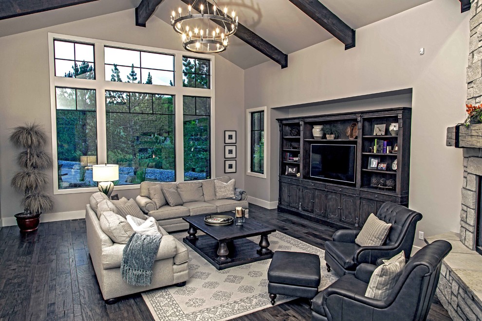 Expansive country open concept living room in Denver with a stone fireplace surround and a built-in media wall.