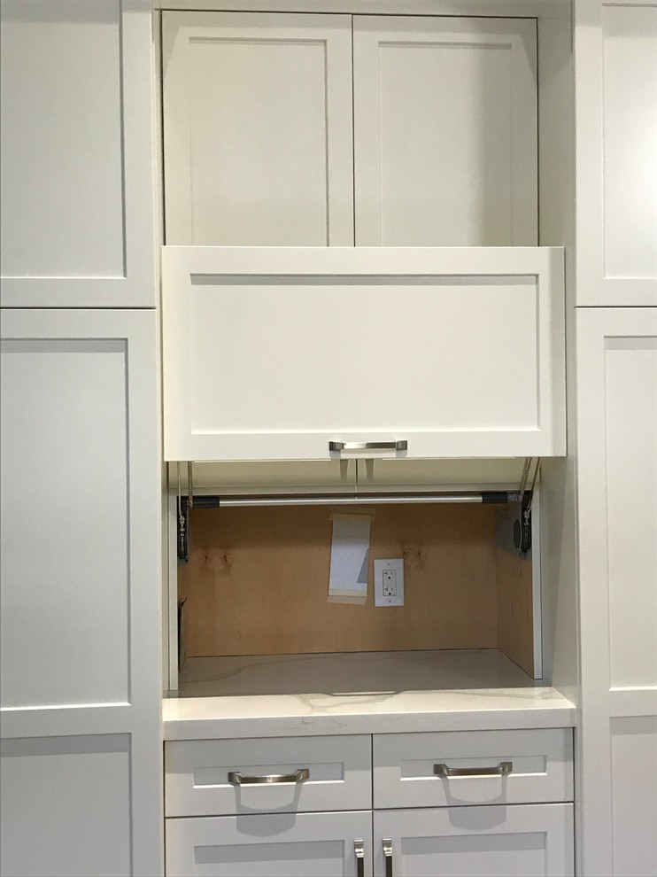 Large transitional kitchen photo in Miami with a farmhouse sink, shaker cabinets, white cabinets, quartz countertops, gray backsplash, glass tile backsplash, stainless steel appliances, an island and multicolored countertops
