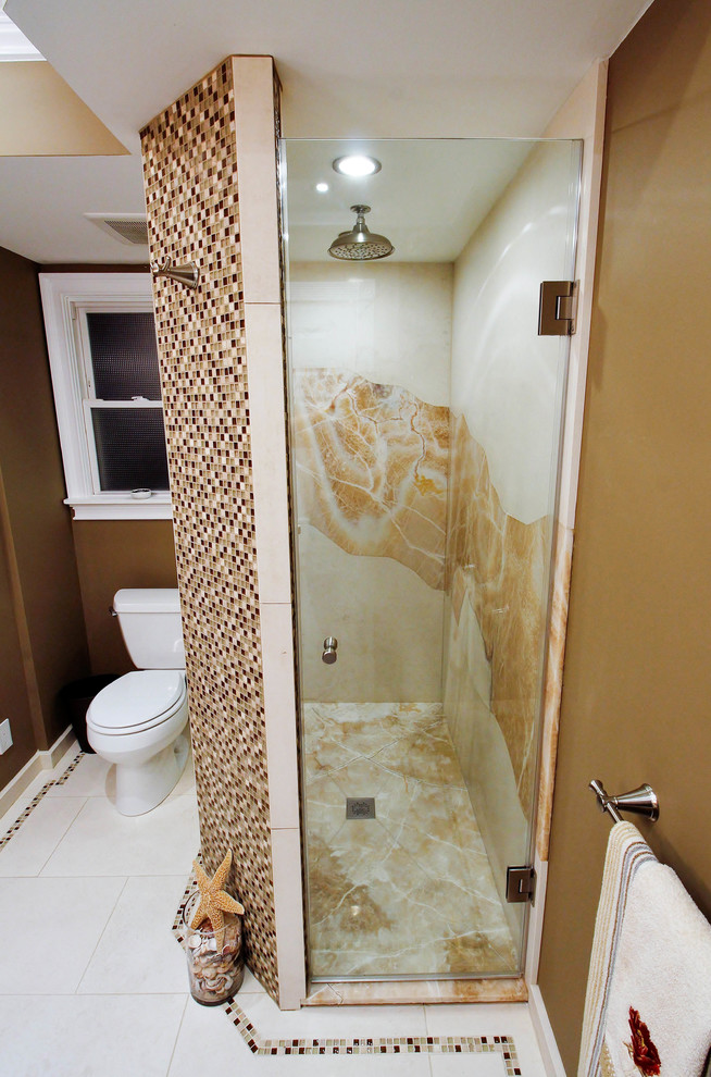 This is an example of a mid-sized transitional master bathroom in New York with flat-panel cabinets, distressed cabinets, a drop-in tub, a corner shower, white tile, marble, beige walls, marble floors and a hinged shower door.