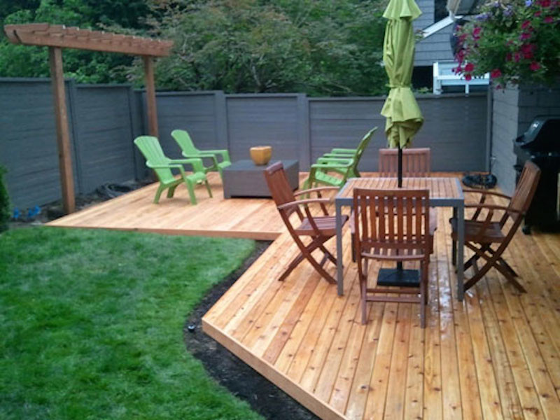 Mid-sized backyard deck photo in Seattle with no cover