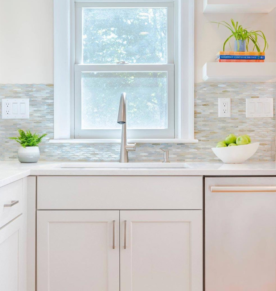 Mid-sized transitional l-shaped kitchen photo with beaded inset cabinets, white cabinets and an island