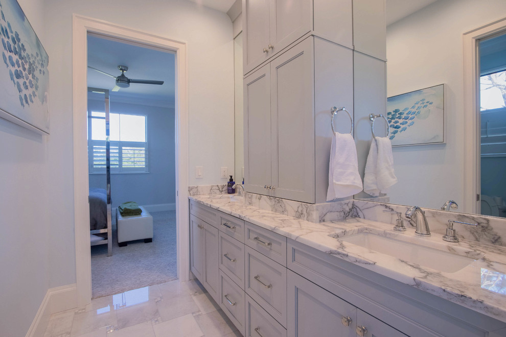 Inspiration for a mid-sized transitional kids' white tile and porcelain tile porcelain tile and white floor bathroom remodel with shaker cabinets, gray cabinets, blue walls, an undermount sink and marble countertops