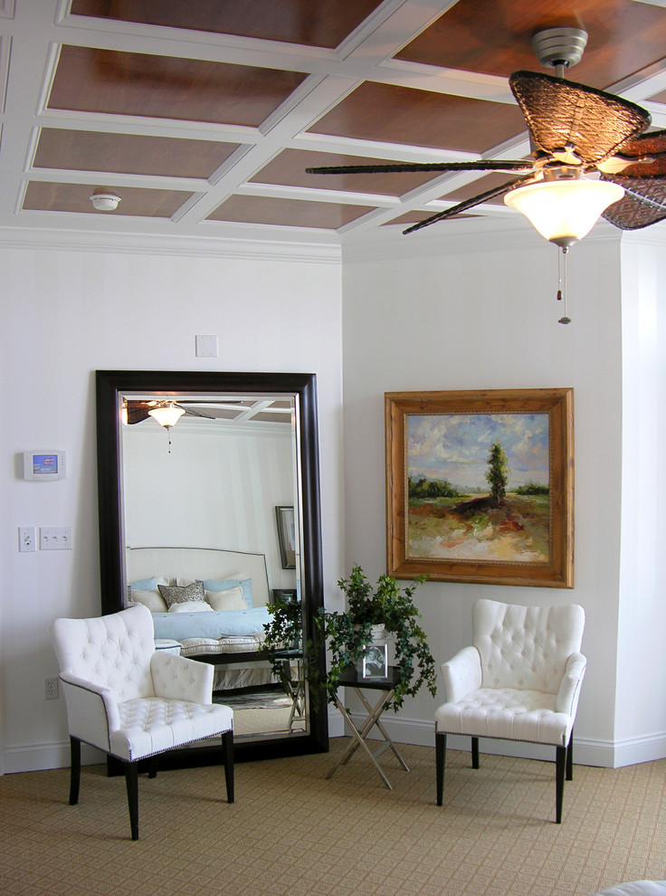 Entry hall - mid-sized coastal carpeted and brown floor entry hall idea with white walls
