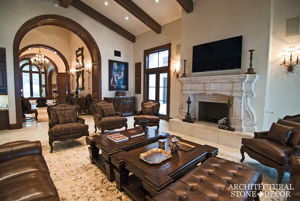 This is an example of a large mediterranean enclosed living room in Toronto with limestone floors, a standard fireplace and a stone fireplace surround.