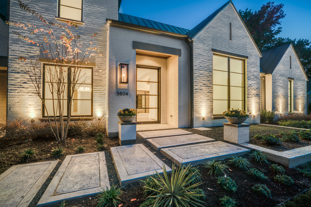 Inspiration for a mid-sized transitional white two-story brick gable roof remodel in Dallas