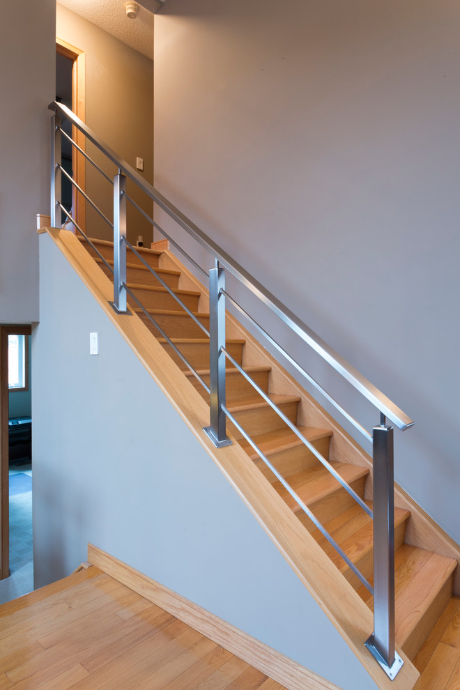 Small industrial wood l-shaped staircase in Other with wood risers.
