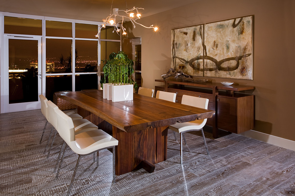 Country dining room in Orange County with brown walls.