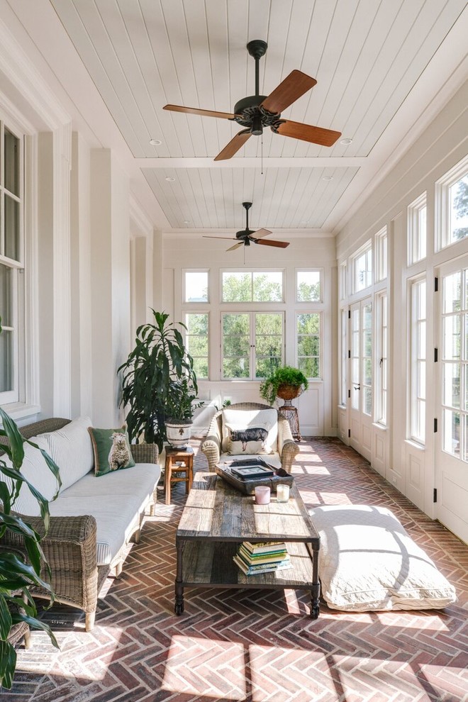 Example of a large classic brick floor sunroom design in Other with a standard ceiling