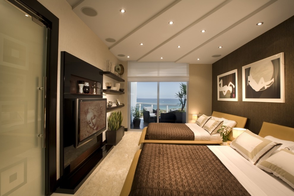 Inspiration for a contemporary guest bedroom in Miami with grey walls and no fireplace.