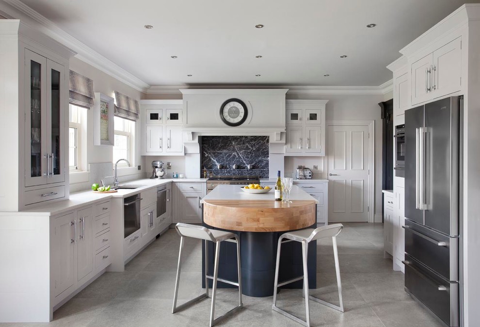 Inspiration for a large modern u-shaped eat-in kitchen in Belfast with an undermount sink, beaded inset cabinets, grey cabinets, quartzite benchtops, grey splashback, stone slab splashback, stainless steel appliances, ceramic floors and with island.