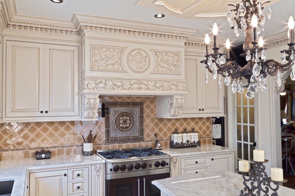 Eat-in kitchen - large traditional u-shaped beige floor and coffered ceiling eat-in kitchen idea in New York with an integrated sink, shaker cabinets, beige cabinets, quartz countertops, brown backsplash, quartz backsplash, an island and beige countertops