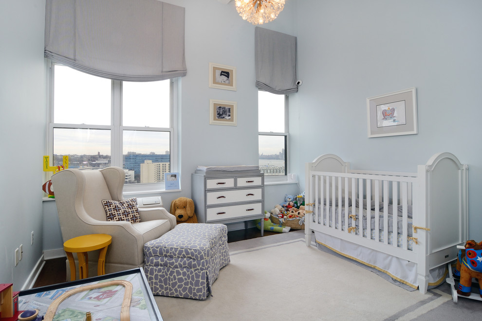 This is an example of a transitional kids' room in New York with blue walls.