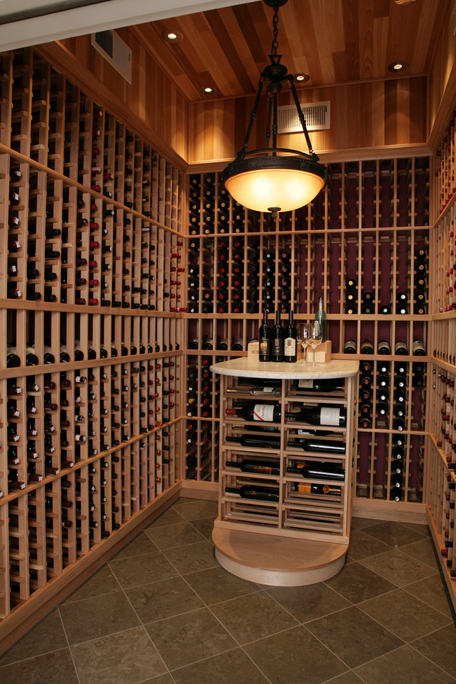 Inspiration for a small traditional wine cellar in San Francisco with porcelain floors, storage racks and brown floor.