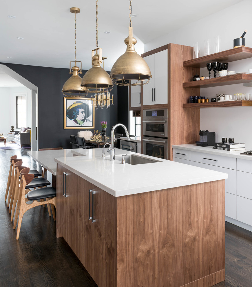 This is an example of a contemporary eat-in kitchen in Toronto with an undermount sink, open cabinets, stainless steel appliances, dark hardwood floors and with island.