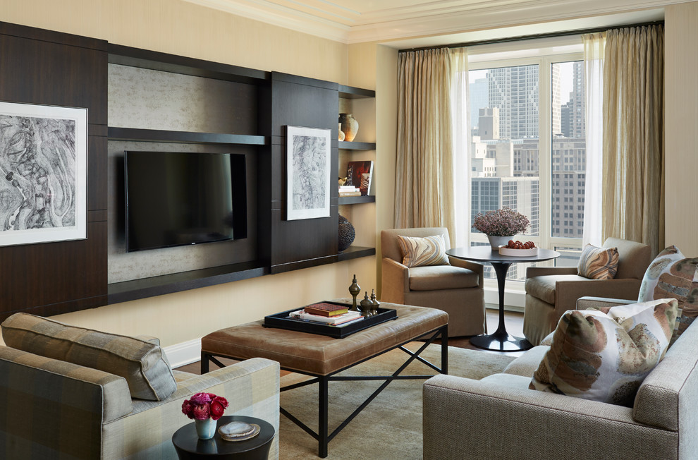 Mid-sized transitional enclosed living room in Chicago with no fireplace, a built-in media wall, beige walls, dark hardwood floors and brown floor.