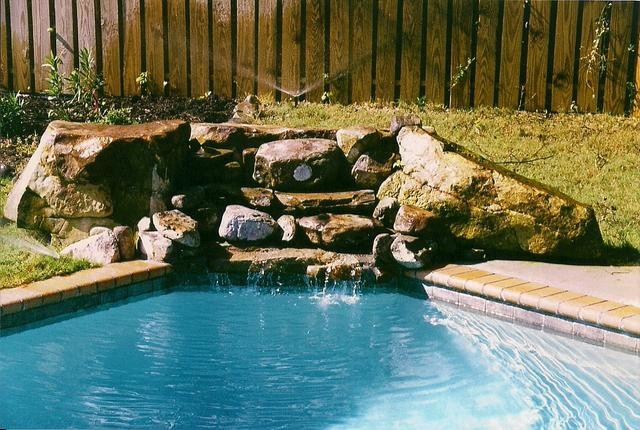 Inspiration for a backyard concrete paver and rectangular lap pool remodel