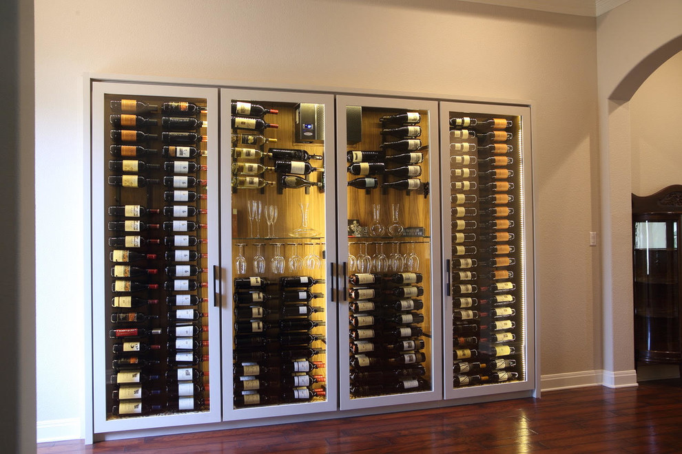 Wine cellar - large transitional dark wood floor and brown floor wine cellar idea with display racks
