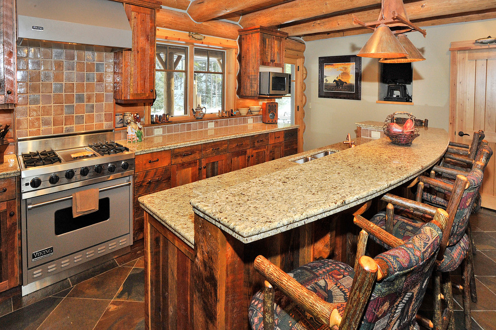 Inspiration for a mid-sized rustic galley slate floor eat-in kitchen remodel with a double-bowl sink, shaker cabinets, distressed cabinets, granite countertops, multicolored backsplash, mosaic tile backsplash, stainless steel appliances and an island
