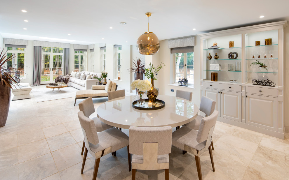 Photo of a large contemporary open plan dining in Buckinghamshire with marble floors.