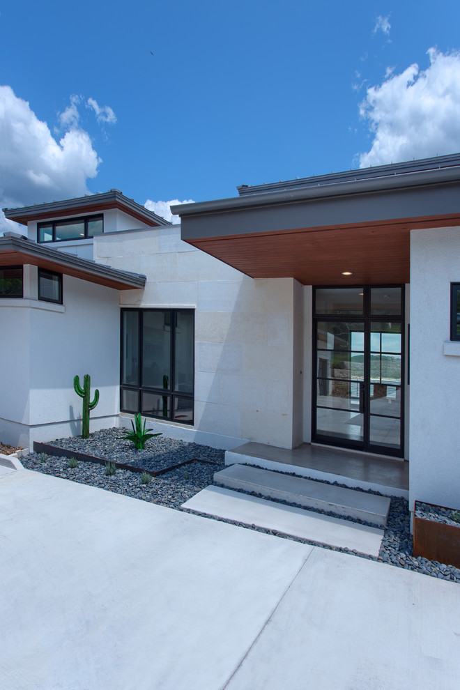Photo of a large contemporary entryway in Austin.