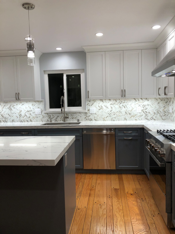 Mid-sized transitional l-shaped medium tone wood floor and beige floor eat-in kitchen photo in San Francisco with an undermount sink, recessed-panel cabinets, turquoise cabinets, quartz countertops, white backsplash, porcelain backsplash, stainless steel appliances, an island and white countertops